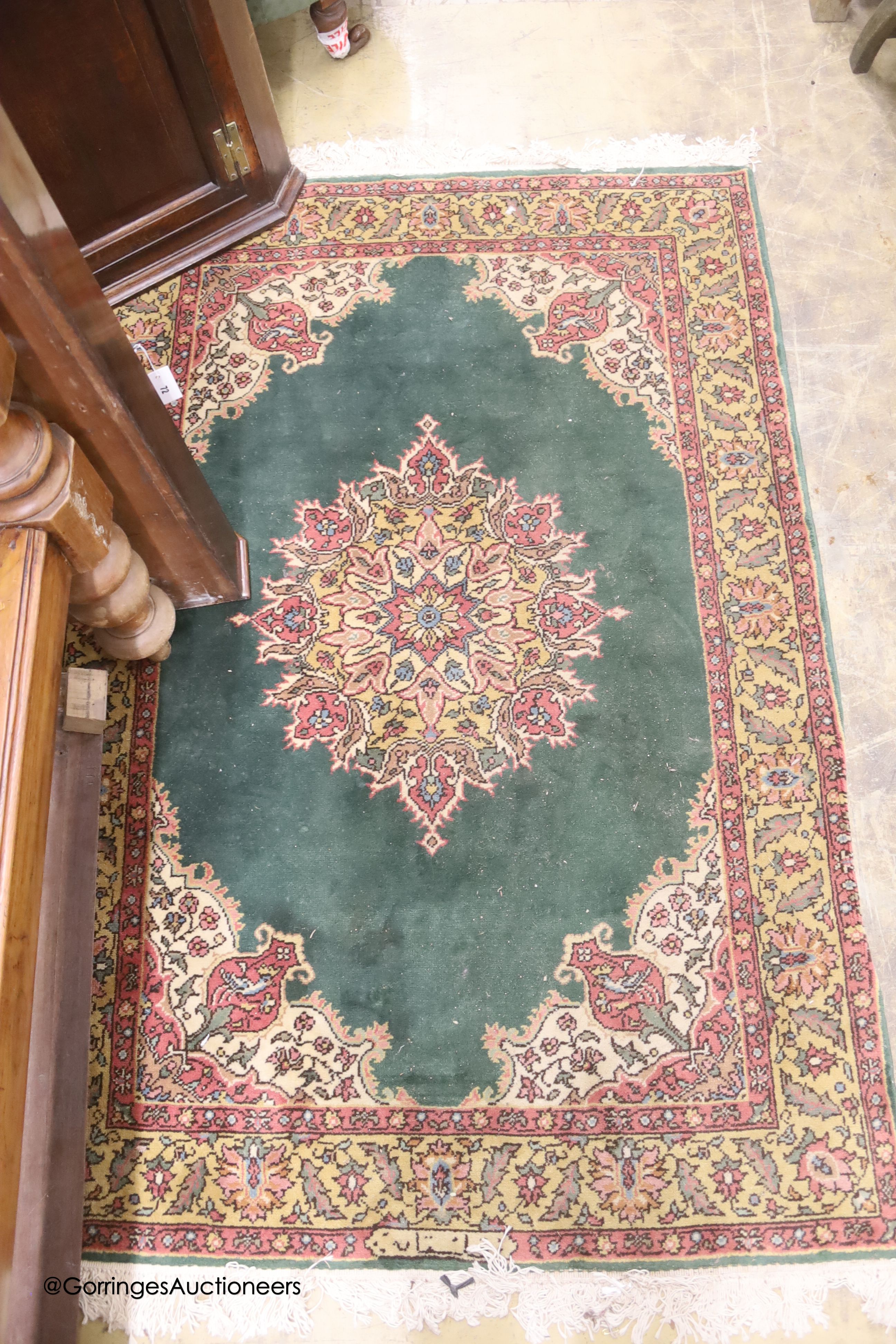 A Romanian green ground rug, 183 x 124cm